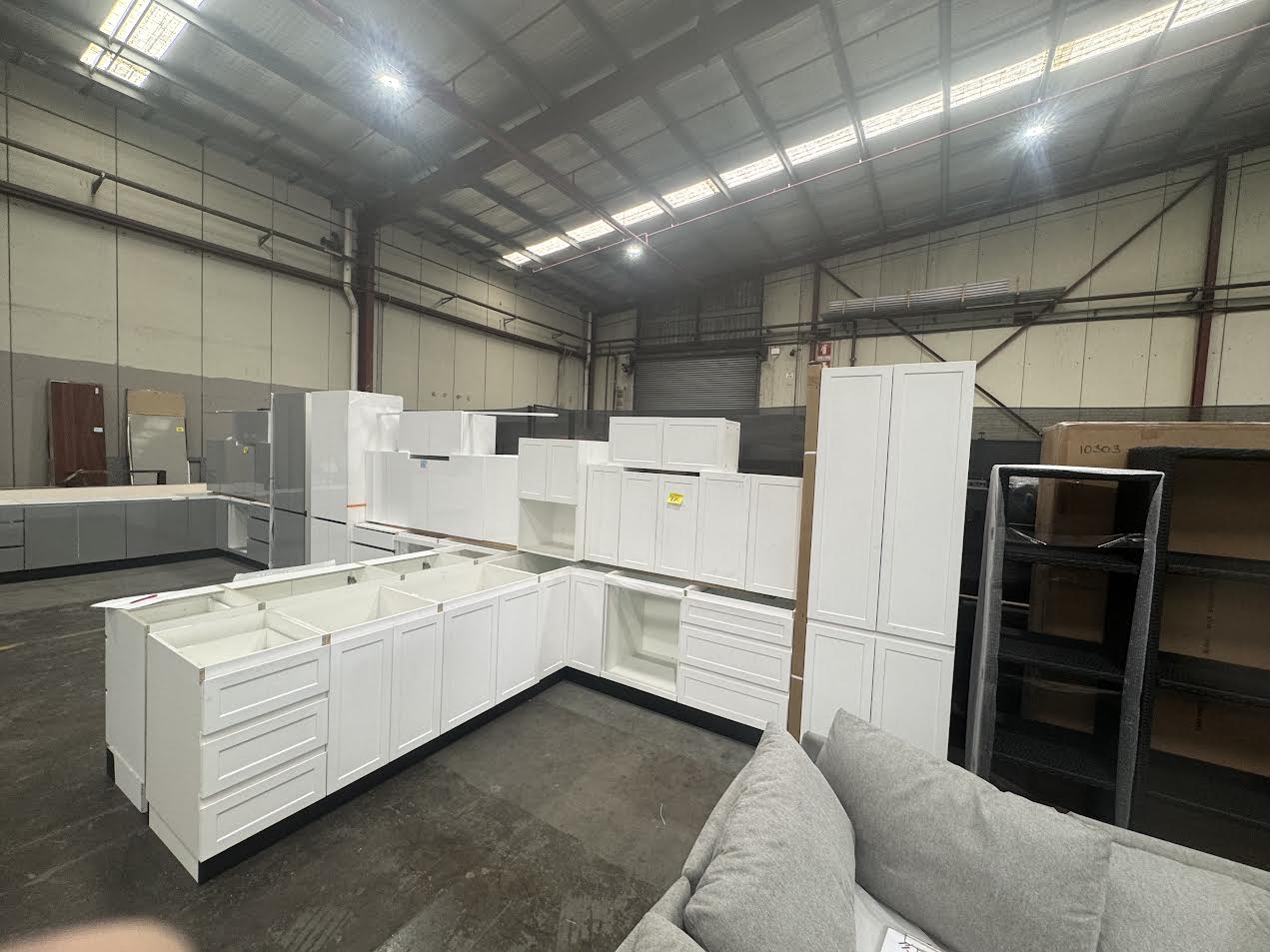 White satin Hampton L-shape handleless kitchen (pick up only).
